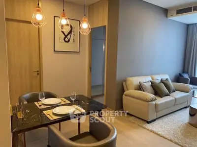 Modern living room with elegant dining area and stylish lighting