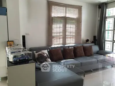 Modern living room with sleek gray sectional sofa and stylish decor
