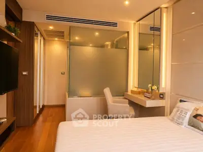 Luxurious bedroom with elegant decor and modern furnishings, featuring a cozy bed and stylish vanity area.