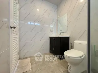Modern bathroom with sleek tiles and contemporary fixtures