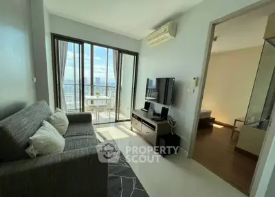 Modern living room with balcony view in high-rise apartment