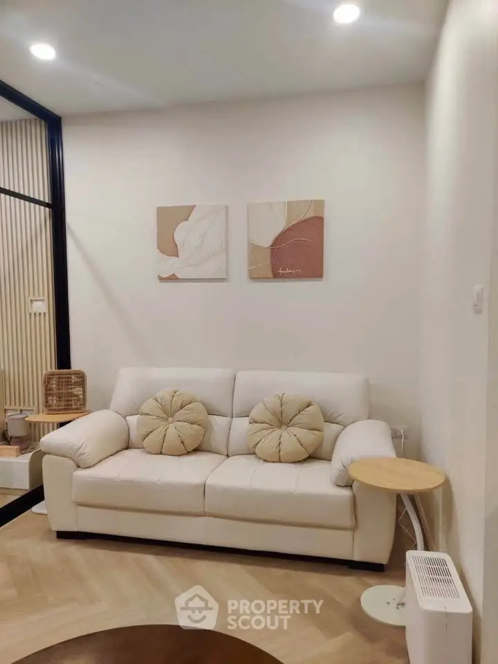 Cozy living room with modern decor and comfortable seating, perfect for relaxation.