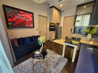 Modern living room with stylish decor, cozy seating, and elegant dining area in a contemporary apartment.