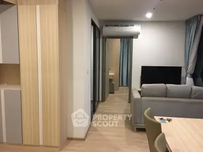 Modern living room with sleek furniture and air conditioning in a stylish apartment.