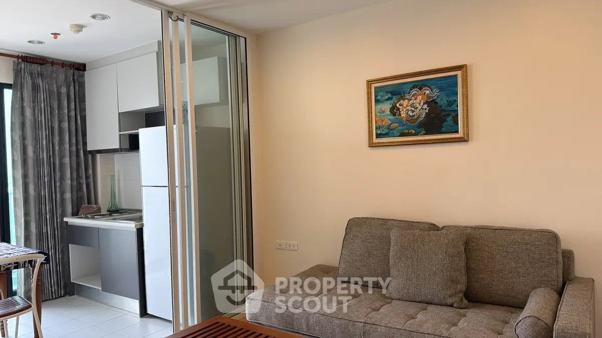 Modern apartment with cozy living room and compact kitchen in open layout