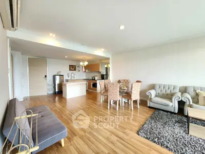 Spacious open-plan living room with elegant dining area and modern kitchen