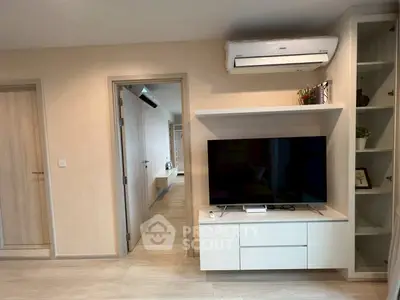 Modern living room with sleek TV unit and air conditioning