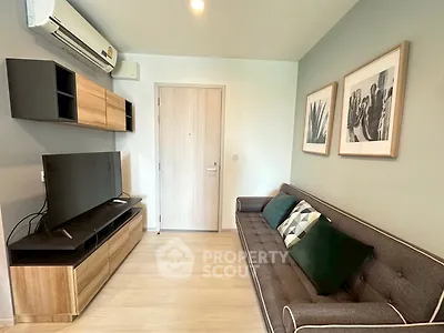 Modern living room with sleek furniture and stylish decor in a cozy apartment.