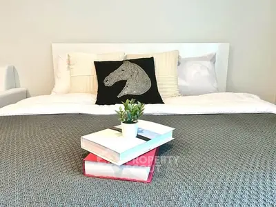 Cozy bedroom with stylish decor and comfortable bedding