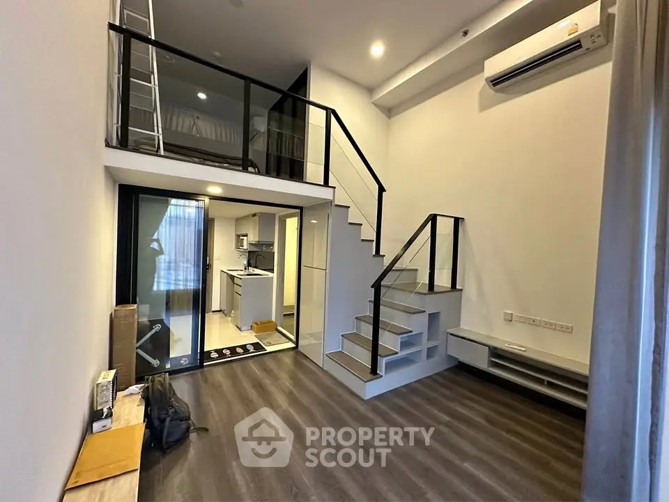 Modern loft apartment with mezzanine and sleek kitchen