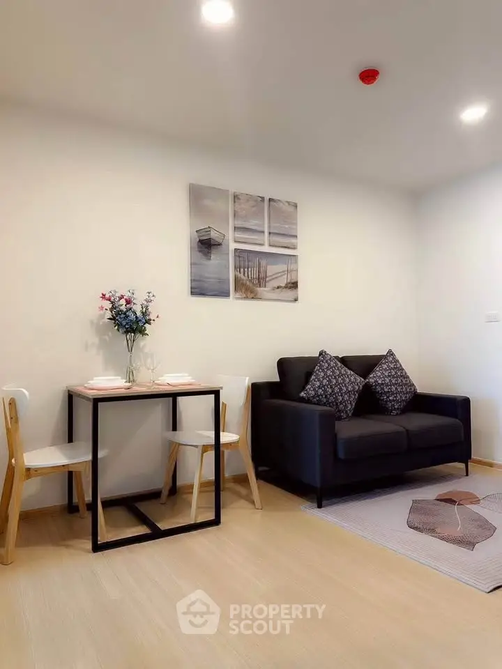 Modern living room with cozy sofa and dining area, perfect for urban living.