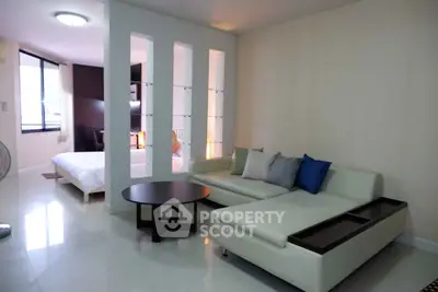 Modern living room with sleek sofa and stylish decor in open layout apartment