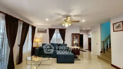 Spacious living room with elegant decor and cozy seating area