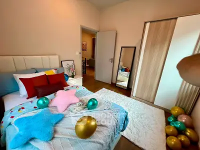 Cozy bedroom with colorful decor and modern wardrobe