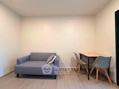 Modern minimalist living room with cozy sofa and dining table set