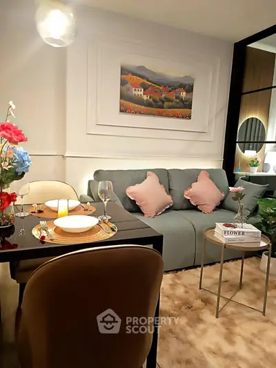 Cozy living room with elegant decor, plush sofa, and stylish dining area, perfect for modern living.