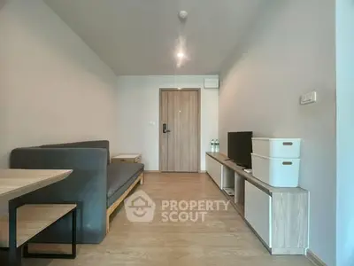 Modern minimalist living room with sleek furniture and wooden flooring