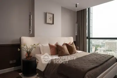 Luxurious bedroom with city view, elegant decor, and plush bedding in a high-rise apartment.
