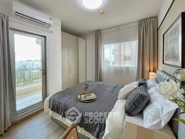 Cozy modern bedroom with balcony access and stylish decor