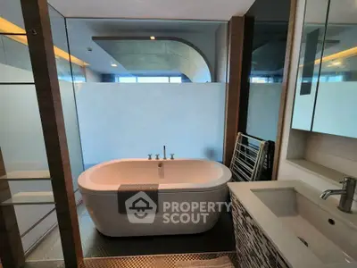 Luxurious bathroom with freestanding bathtub and modern fixtures