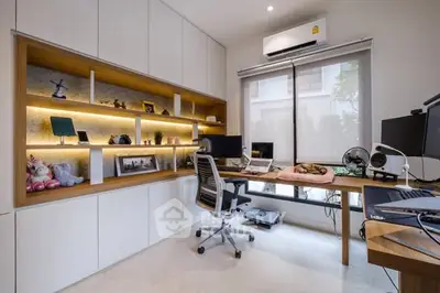 Modern study room with built-in shelves and natural light