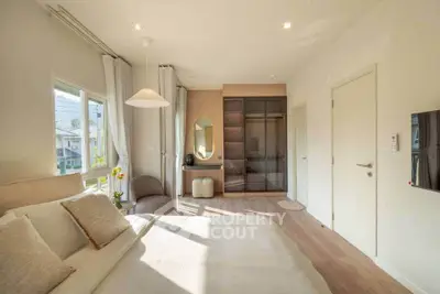 Bright and modern bedroom with elegant decor and ample natural light