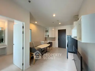 Modern living room with sleek furniture and open layout in a contemporary apartment.