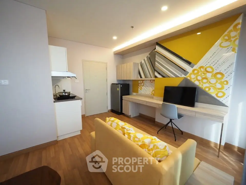 Modern living room with stylish decor and open kitchen layout
