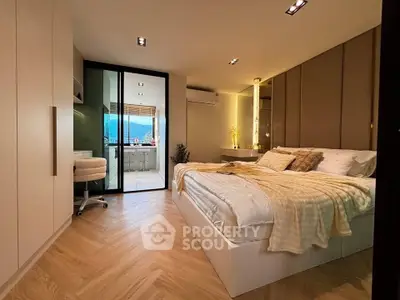 Luxurious bedroom with modern decor and stunning view from balcony.