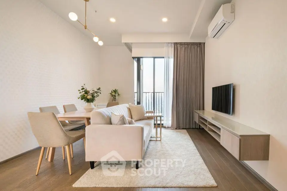 Modern living room with elegant decor and balcony view
