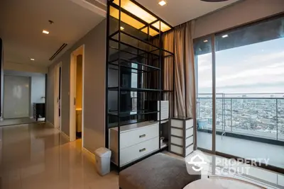 Luxurious high-rise corner unit with expansive city views, featuring a sleek modern living room with floor-to-ceiling windows and elegant furnishings.