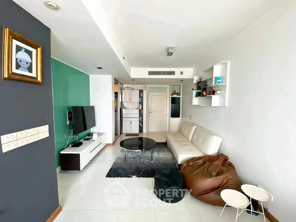 Modern living room with sleek furniture and stylish decor in a contemporary apartment.