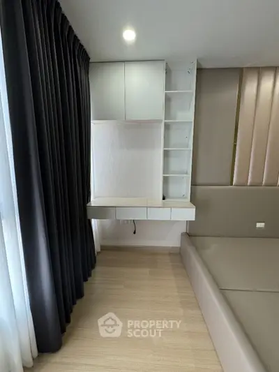 Modern bedroom with built-in storage and elegant design