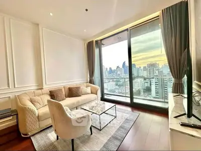 Luxurious living room with stunning city view and elegant furnishings.