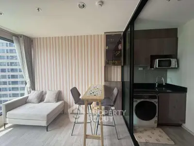 Modern studio apartment with stylish kitchen and cozy living area