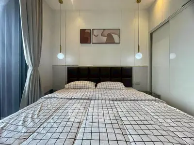 Modern bedroom with stylish decor and large window for natural light