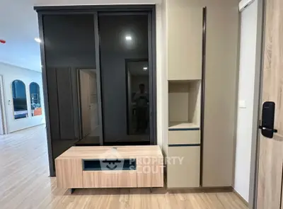 Modern living room with sleek furniture and wooden flooring