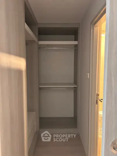 Spacious walk-in closet with modern shelving and ample storage space.