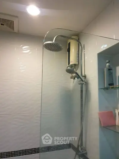 Modern bathroom with sleek shower design and built-in shelving