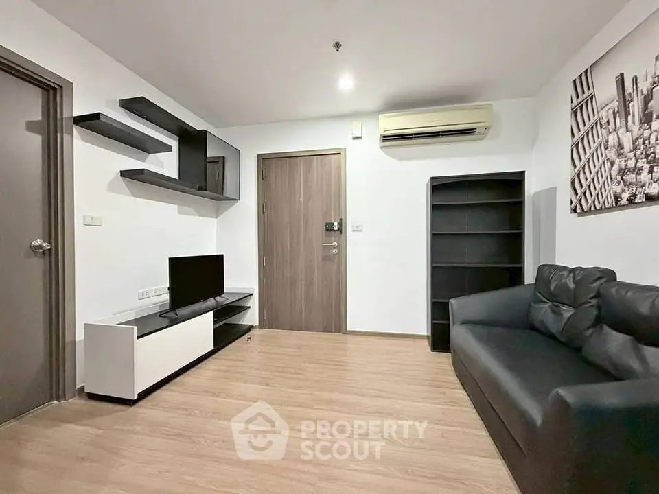 Modern living room with sleek furniture and air conditioning in a stylish apartment.