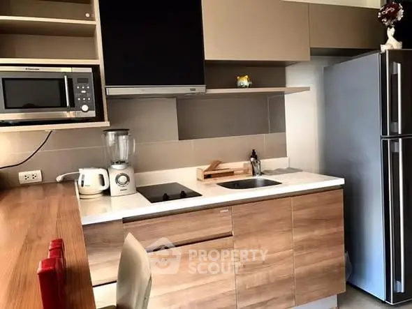 Modern kitchen with sleek cabinetry and stainless steel appliances