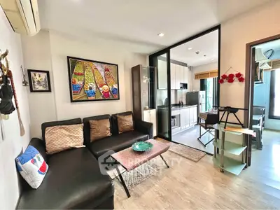 Modern living room with open kitchen and stylish decor