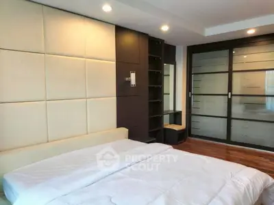 Modern bedroom with sleek design and ample storage space