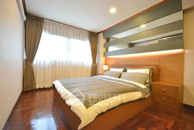 Spacious bedroom with modern design and ample natural light