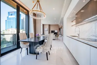 Luxurious open-plan kitchen and dining area with city view