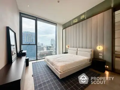 Modern bedroom with large window offering city view and stylish decor