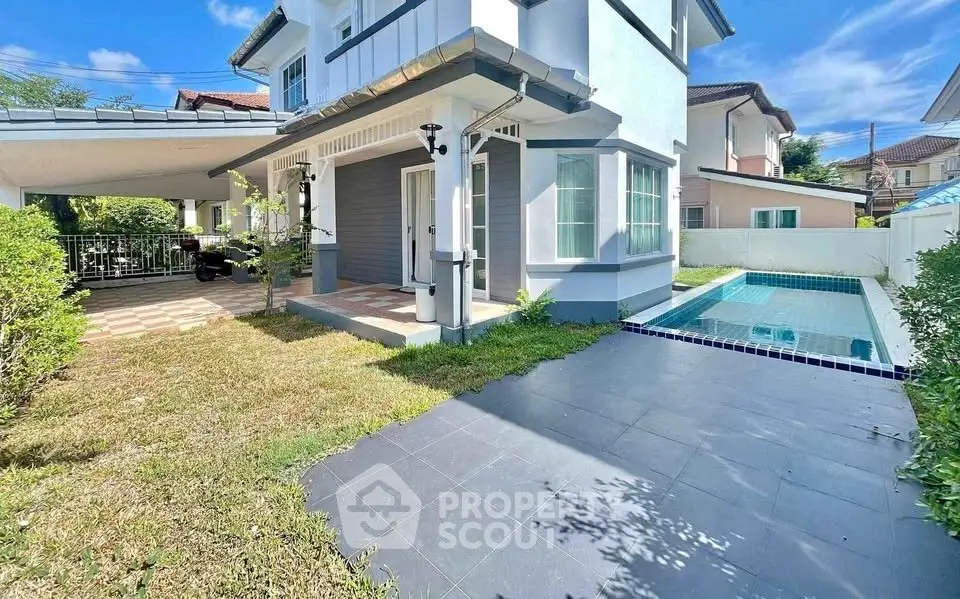 Charming two-story house with private pool and lush garden, perfect for family living in a serene neighborhood.