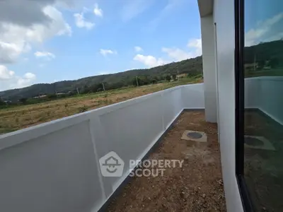 Spacious balcony with scenic mountain views in modern property