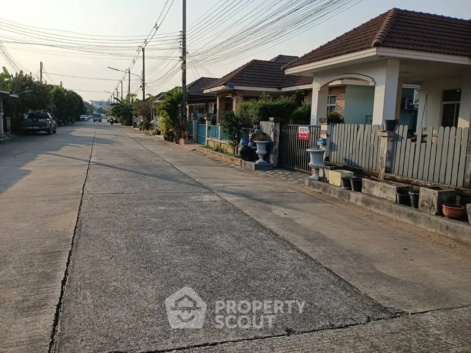 Charming suburban street view with cozy homes and lush greenery, perfect for family living.