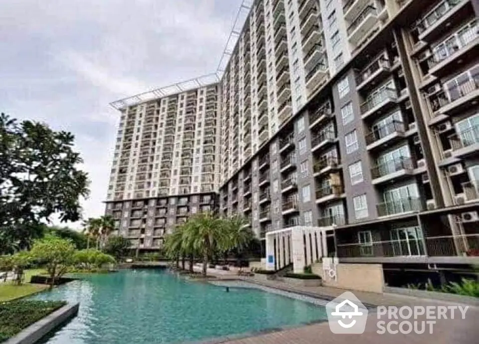 Luxurious high-rise condominium with stunning pool and lush garden view.